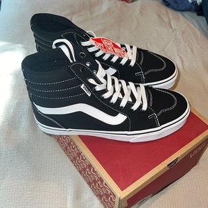 Black and white high top vans